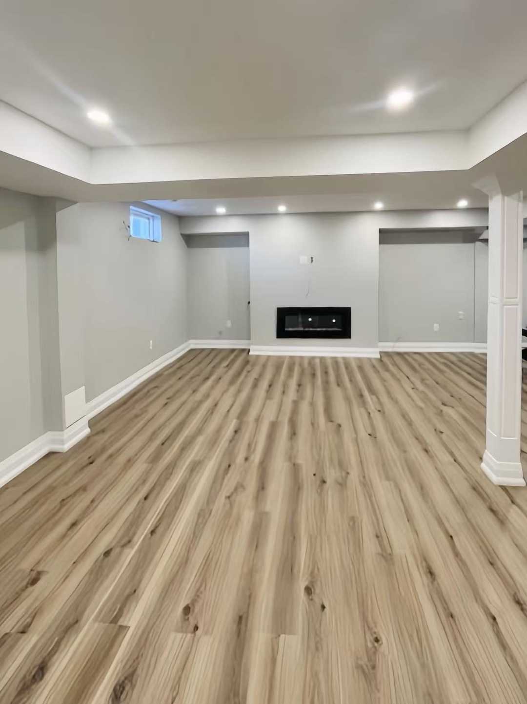 Grey vinyl flooring with built in tv wall, wet bar - Image 3