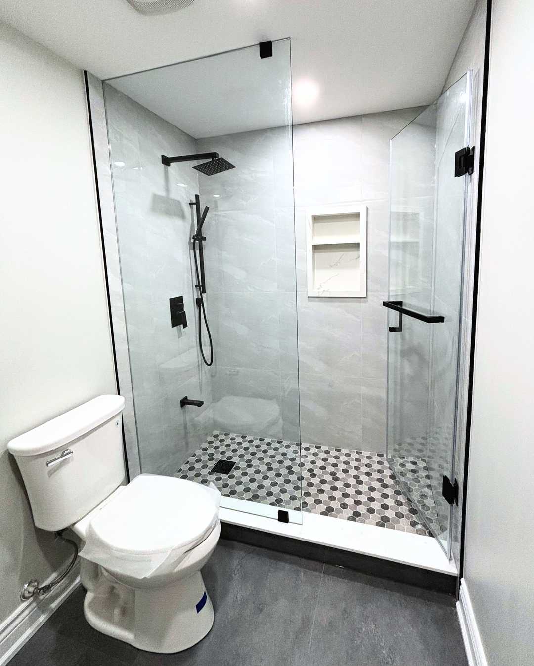 Grey vanity with white quartz counter, black shower faucet and - Image 2