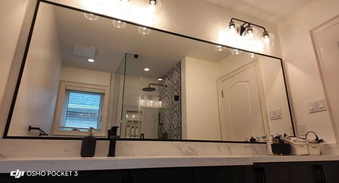 black frame LED mirror with custom shower glass