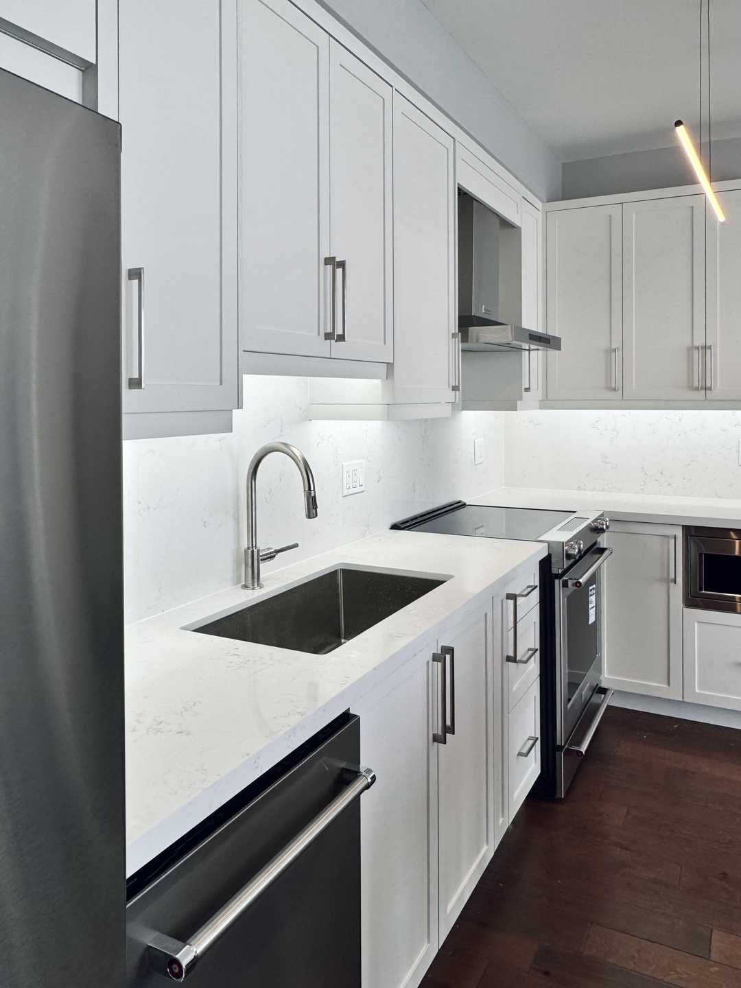 2 bathroom with white shaker kitchen cabinet
