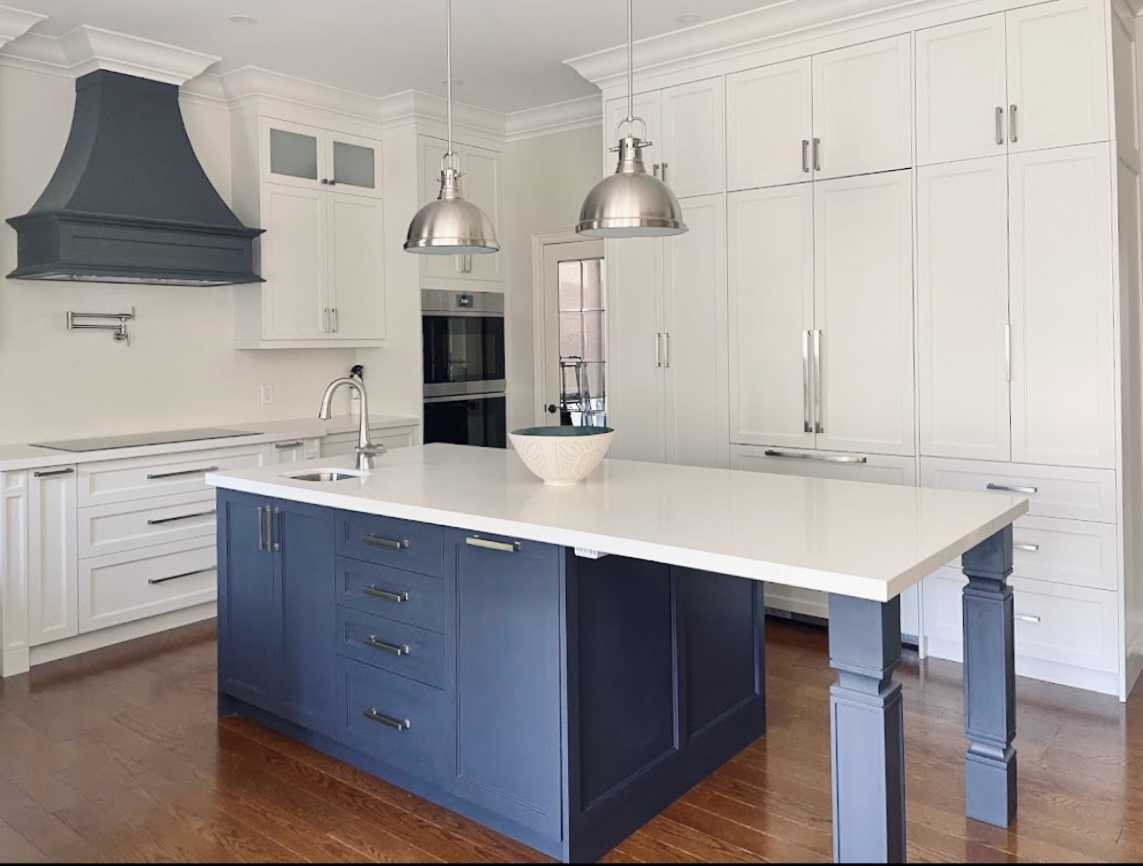 Complete home renovation with a statement wavy-textured fireplace wall. Kitchen - Image 11