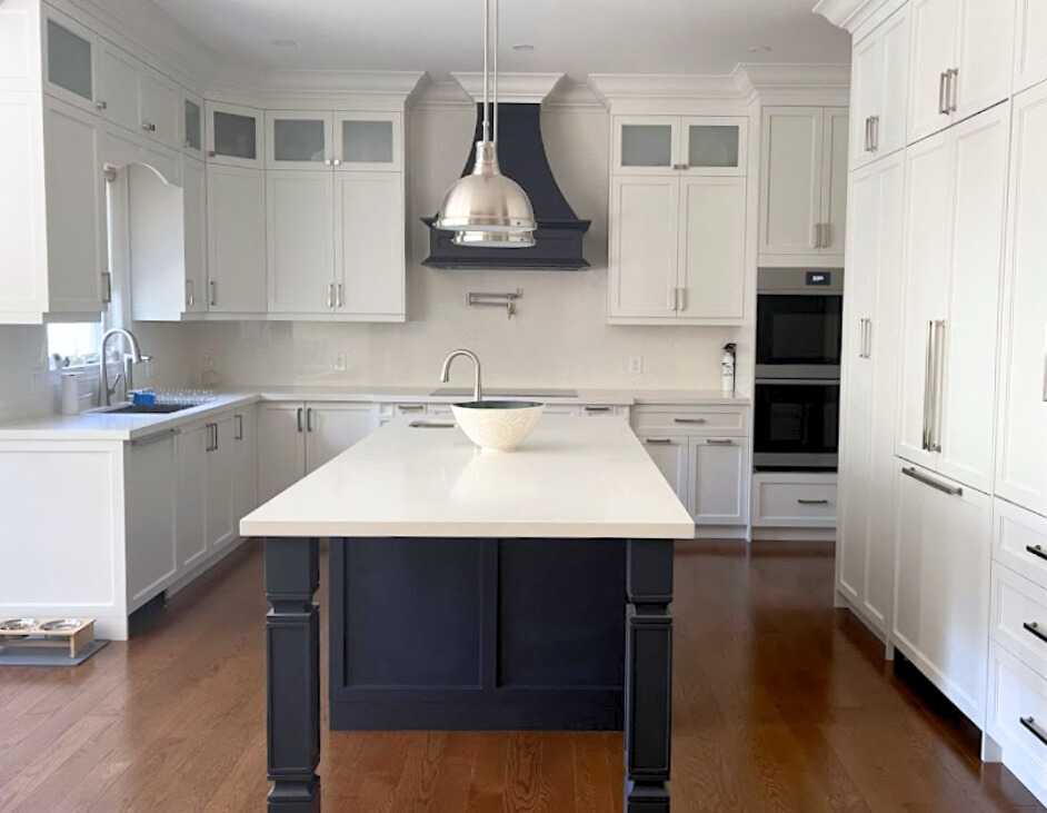 Complete home renovation with a statement wavy-textured fireplace wall. Kitchen - Image 8