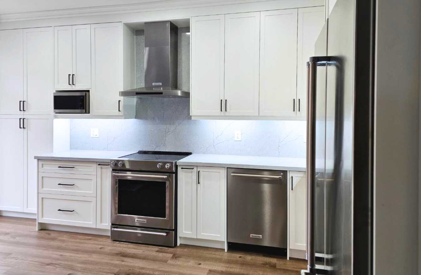 White shaker Built-in customize kitchen cabinets with drawers with brownish