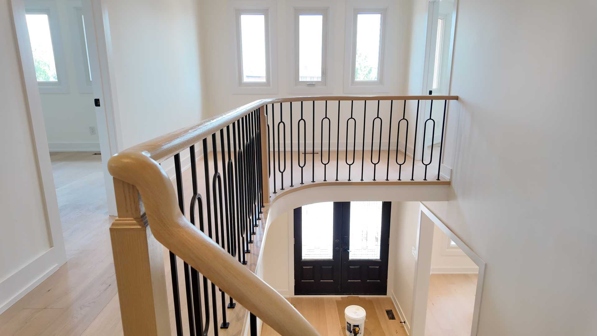 blonde wood flooring， with smooth rounded handrail - Image 2