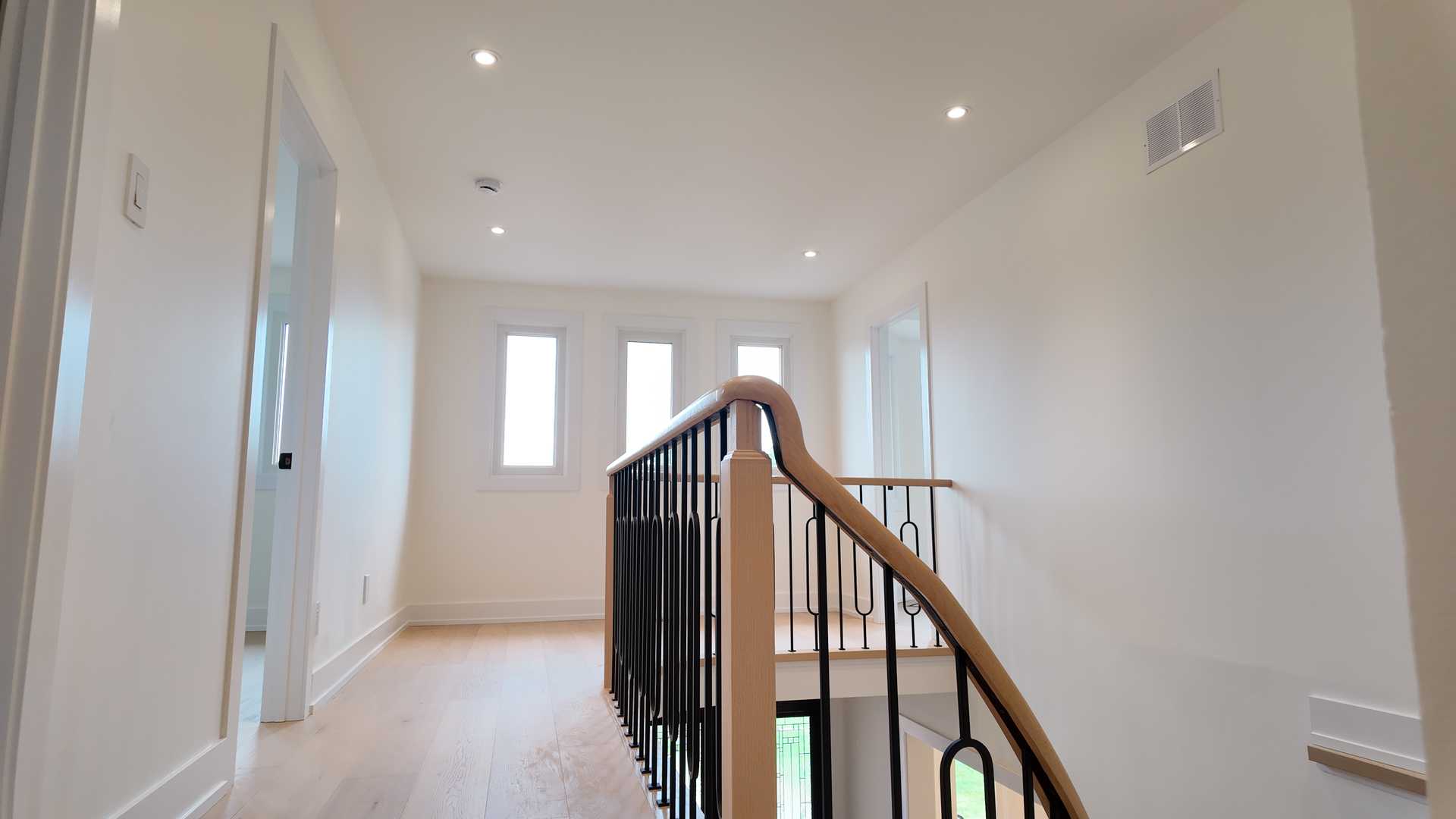 blonde wood flooring， with smooth rounded handrail - Image 8