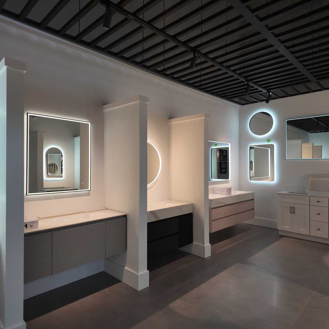 Bathroom renovation display at Sun Sea Sky Reno showroom in Vaughan featuring modern vanities and walk-in showers