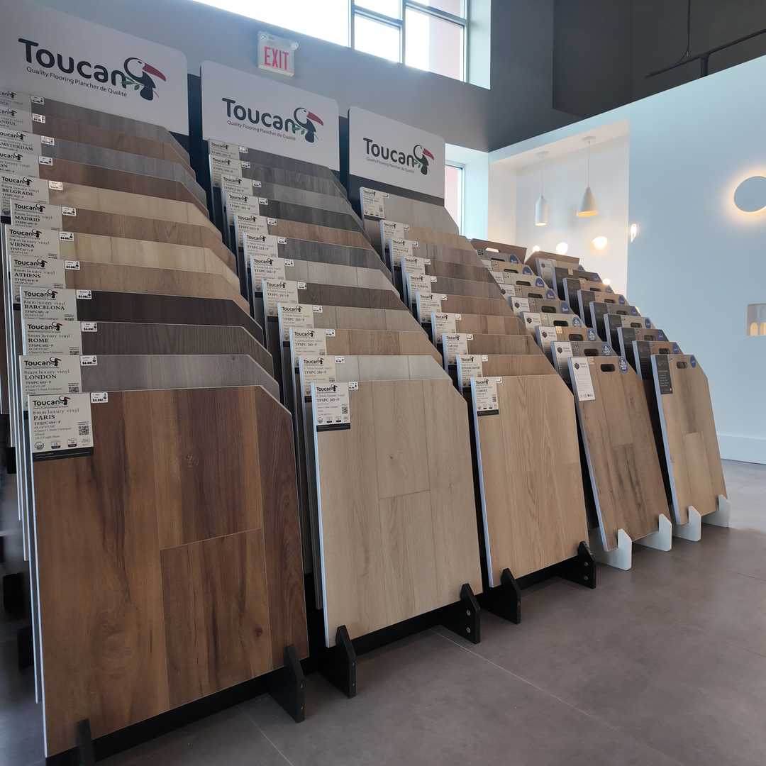 Flooring samples display featuring hardwood, vinyl plank, and porcelain tiles at Vaughan renovation showroom
