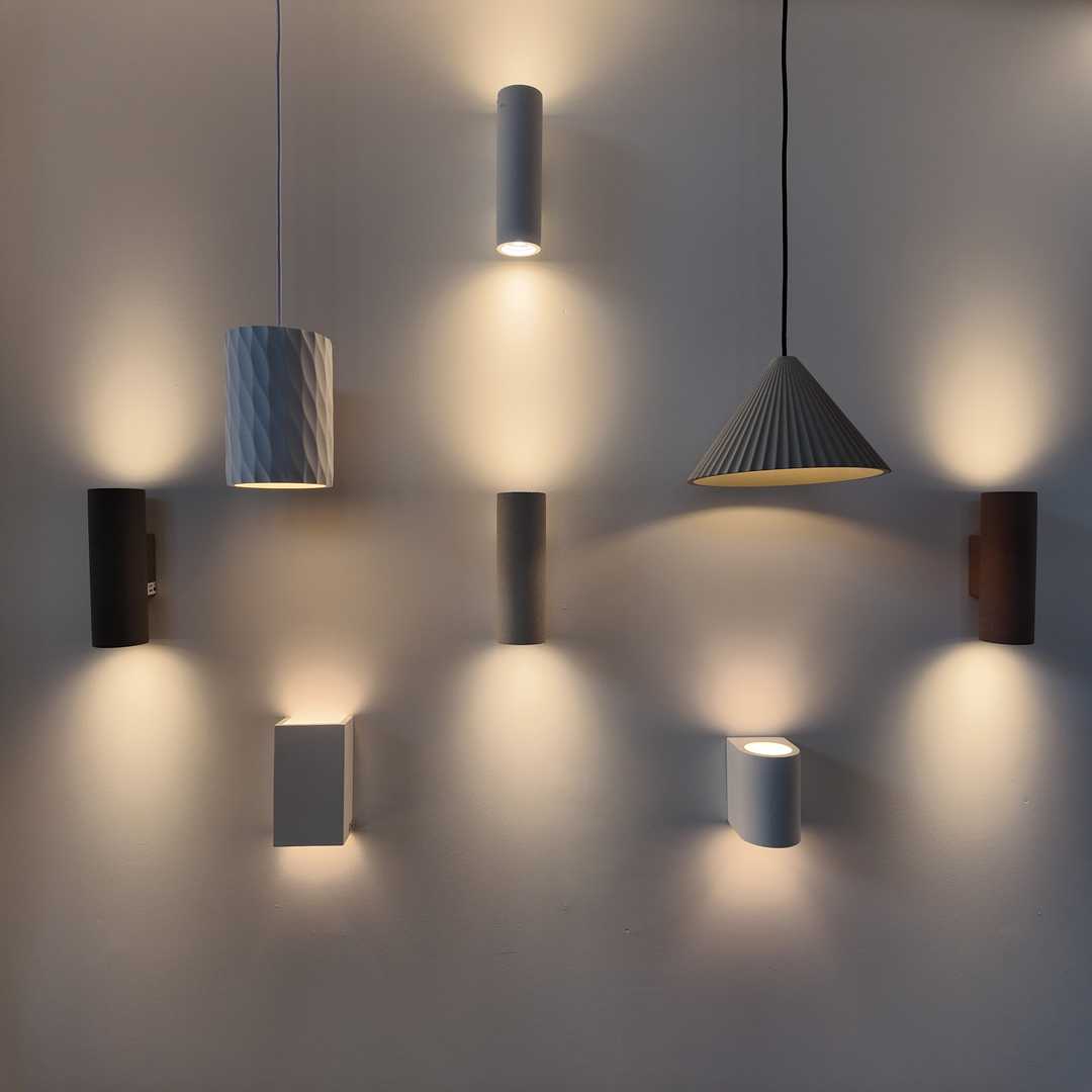 Lighting fixture display showing pendant lights, recessed lighting, and vanity fixtures for kitchen and bathroom renovations